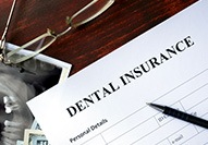 dental insurance form on table