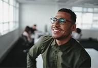 a smiling man with glasses