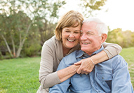 Dentures patient in Carmel smiling with their partner