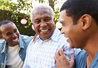 Dentures patient in Carmel talking with family