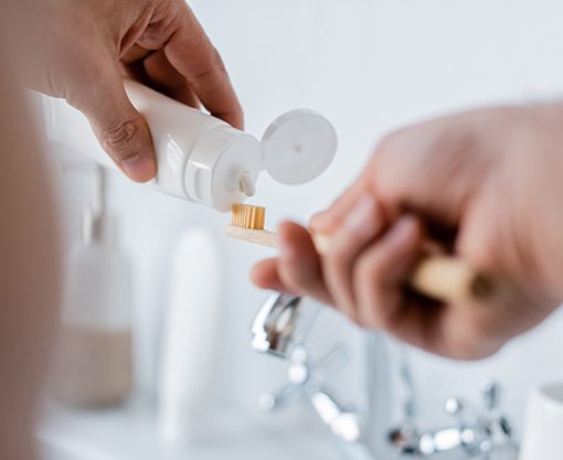 Close up of toothpaste being squeezed onto toothbrush