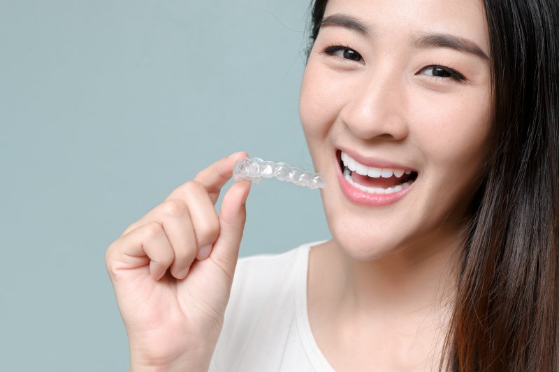 person correcting bite problems with Invisalign